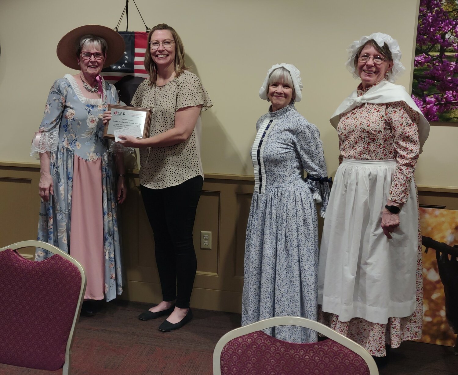 As the country approaches its 250th birthday, the Oceanus Hopkins Chapter of the Daughters of the American Revolution presented an America 250 Celebration Grant to Pittsburg State University in the amount of $500 to purchase American flags to be flown at the Veterans’ Memorial in Pittsburg. Pictured, from left, are Mary Gilpin; Becky McDaniel, Associate VP for University Advancement; Donita Dupslaff; and Linda Shultz.