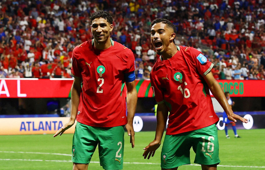 Morocco's Gessime Yassine celebrates scoring their fourth goal with Achraf Hakimi after a VAR review