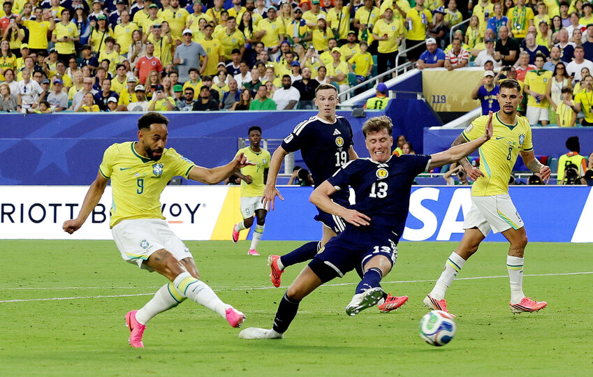 Brazil's Matheus Cunha scores their third goal