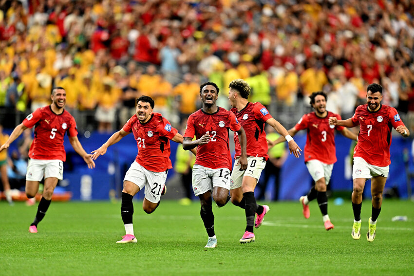 Egypt players celebrate after the match as Egypt qualify for the Round of 16 stage of the World Cup