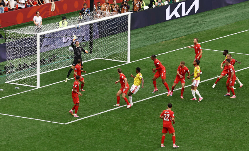 Switzerland's Gregor Kobel in action as he saves a header from Colombia's Jhon Lucumi