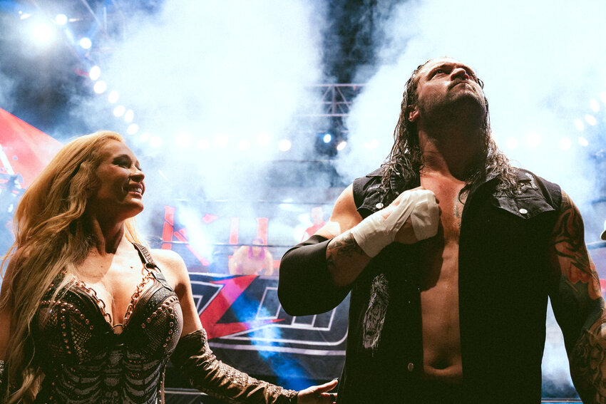 Scarlett Bordeaux (left) standing next to MLW World Heavyweight Champion Killer Kross (right).