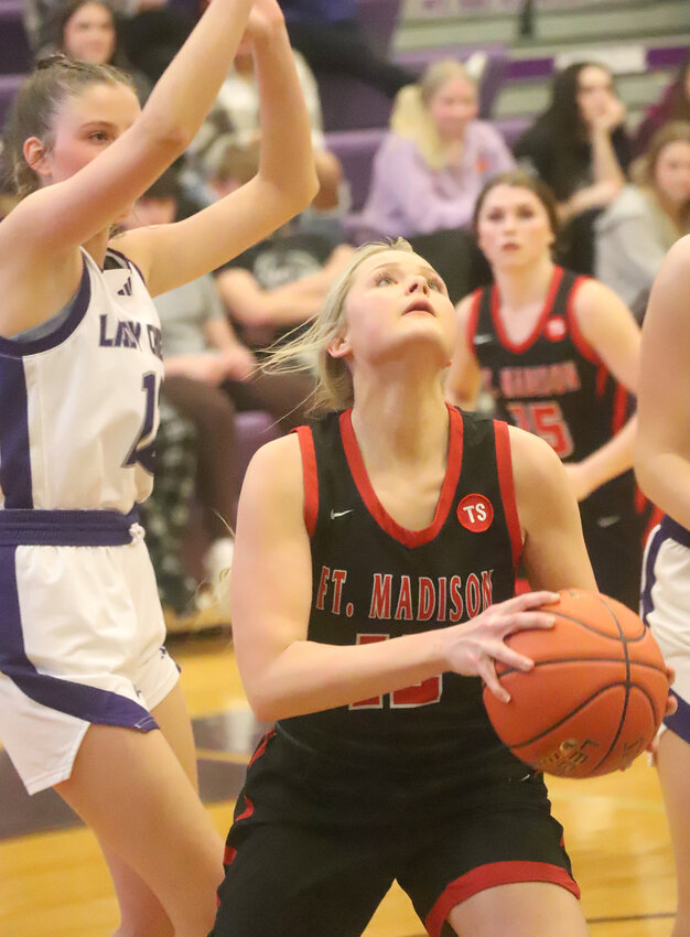 Fort Madison senior Taylor Johnson looks for a shot under the basket in the second half of the Lady Hounds loss to Keokuk Saturday night.