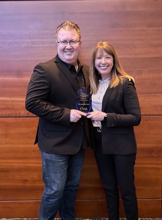 Adam and Julie Hohl pose with the Iowa Tourism's Outstanding Retail Experience award given during last week's Iowa Tourism Conference in Des Moines.