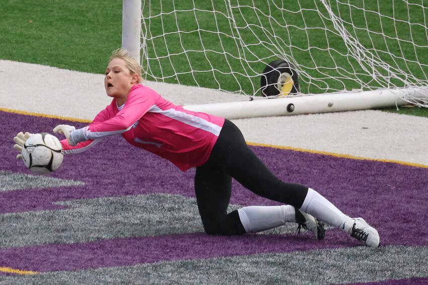 Fort Madison High School goalkeeper Taylor Johnson (1) makes a save during their game against Burlington High School, Thursday, April 11, 2024 at Burlington's Bracewell Stadium.