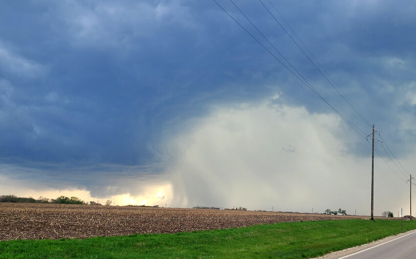 A rain cell opens up under storm clouds looking west  at 180th Street and X32 north of Fort Madison during Tuesday's thunderstorms that produced at least one confirmed tornado just west of Houghton.