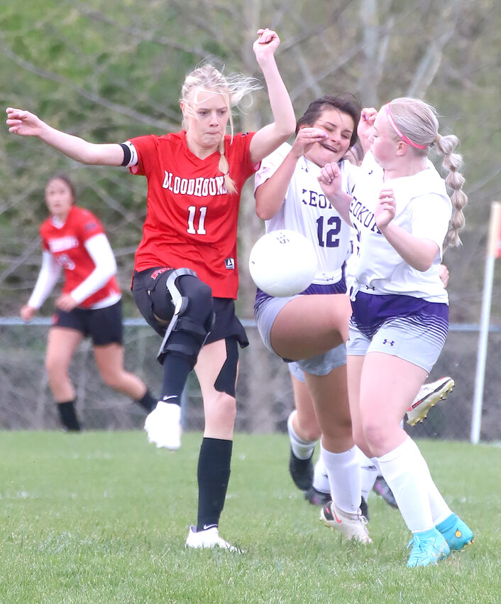 Fort Madison's Natalie Randolph battles with two Keokuk defenders in the first half of the Lady Hounds 12-0 win Monday at Baxter Sports Complex.