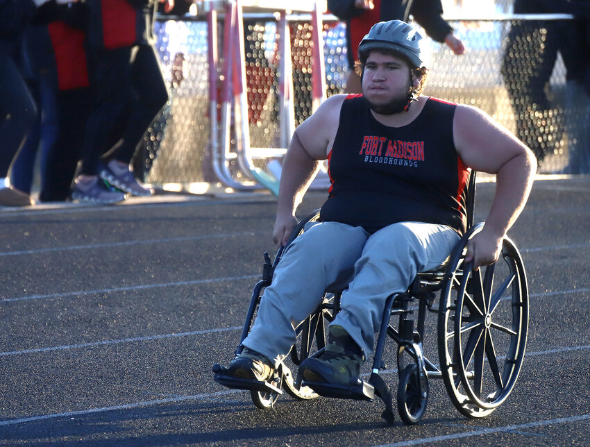 Fort Madison's Brandon Klein rolls to a first place finish in the 201-yard wheel chair event Tuesday in Fort Madison. The Hounds hosted the Keokuk Co-Ed Relays while construction remains under way on the Chiefs' facility.