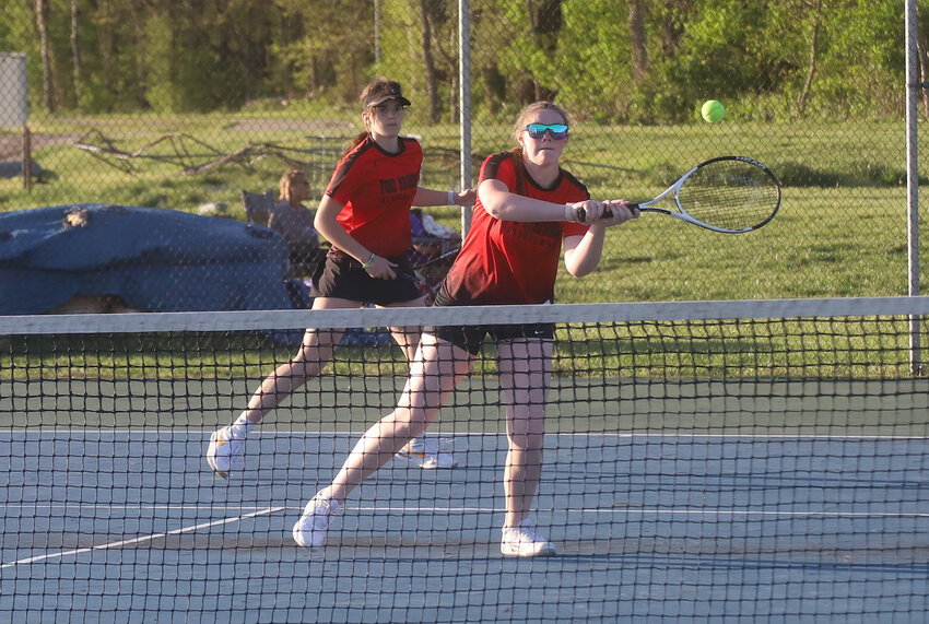 Fort Madison's Elizabeth Tanner returns a volley in the Bloodhounds' No. 2 doubles match with BHS on Tuesday. The Hounds lost 9-0 but are showing steady improvement with more than 30 girls on the team.