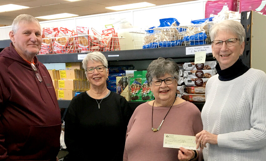 Lin Cramer, second from right, presents a check from the Fort Madison Elks Lodge, to the Fort Madison Food pantry for $2,000 last week.