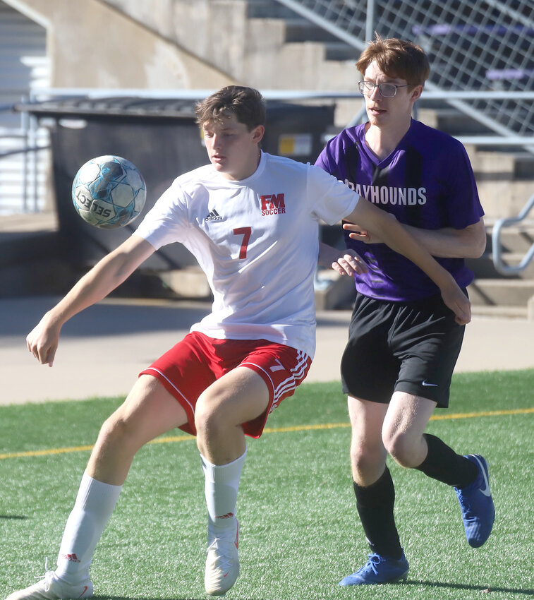 Fort Madison junior forward Henry Graham (7) gets ready to work a ball on the Bloodhounds' half of the pitch just minutes into Monday's match with the Burlington Grayhounds. Graham would go down with an injury on the play and remain out the rest of the game.