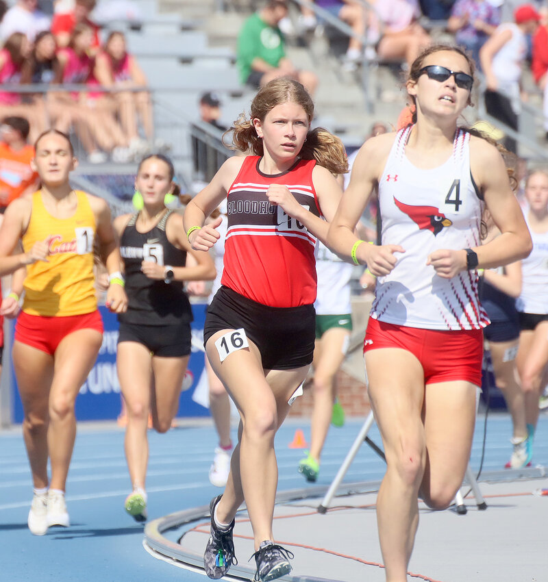 Sophomore Avery Rump makes the 1st turn right behind Maquoketa's Isabelle Hardin in the 3A girls' 3000-meter run Thursday at the IGHSAU State Track and Field meet in Des Moines. Rump would run to a 10:27.75 which was good enough for 5th place overall and a personal best for Rump in 2024.