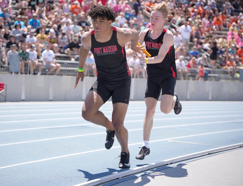 Fort Madison’s Dayton Lamar hands off to Hayden Segoviano in a boys' 3A 4X100 Meter Relay preliminary race during the Iowa High School State Track and Field Championships Saturday, May 18, 2024, in Des Moines, Iowa.