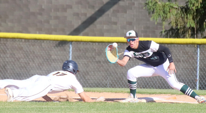 WBND's Brock Thuleen waits on a pick-off throw to arrive to try and catch Central Lee's Brayden Wyrick leading off Friday in Donnellson. The Hawks would knock off the Falcons 7-1 in a Southeast Iowa Superconference matchup.
