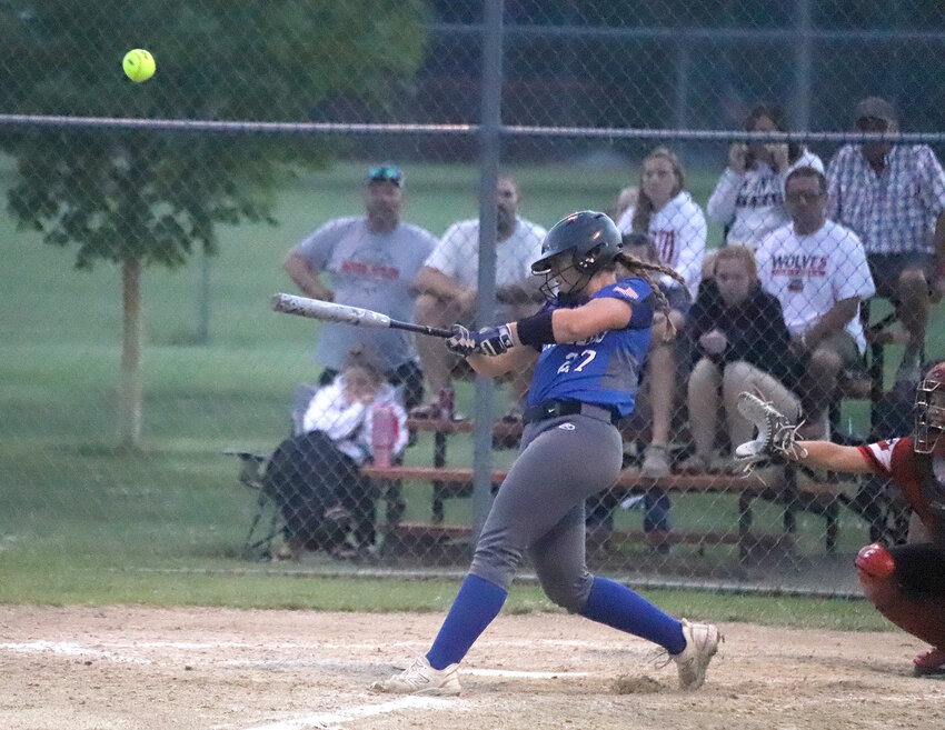 Holy Trinity's Emily Ross connects on a pop fly single in the bottom of the seventh inning Wednesday at South Park in West Point. Ross went 3-5 on the night with two runs scored.