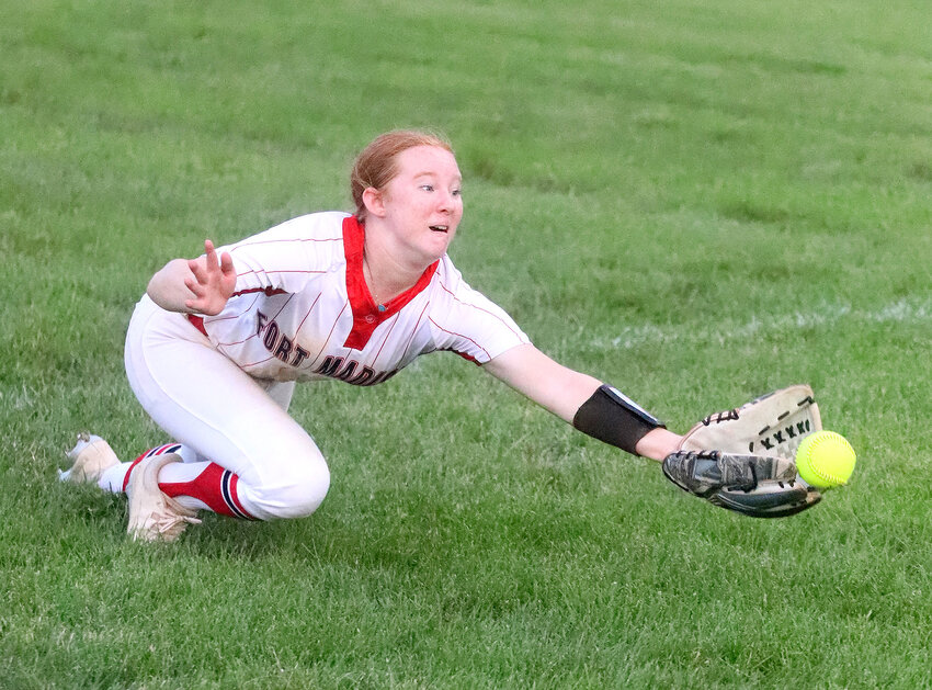 Kylie Lumino looks to her first base coach after reaching base on one of her two hits in Thursday's 18-7 win over Keokuk in Class 4A regional softball action at Joyce Park in Keokuk. The Hounds pounded out 16 hits in the win.