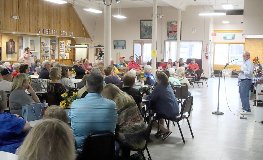 Lee Couunty Supervisor Tom Schulz talks with about 80 people at the Newberry Center in Fort Madison as part of a town hall meeting Wednesday evening. The town hall discussion focused on the potential closure of the county-owned senior center.