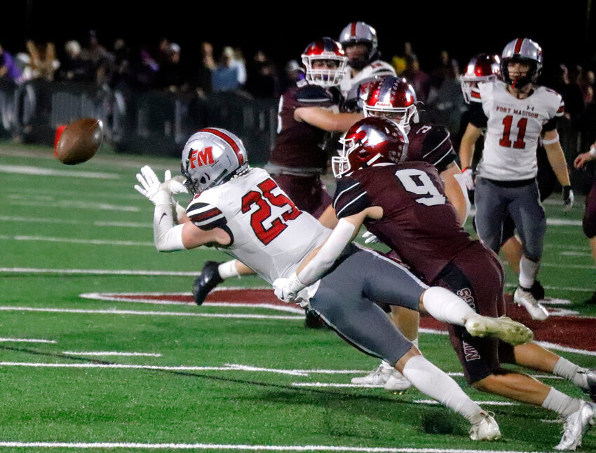 Senior Brody Cashman has a pass from Marcus Guzman go off his hands in the second quarter of Friday's 56-7 loss to No. 10 Mt. Vernon Friday night in Mt.  Vernon.