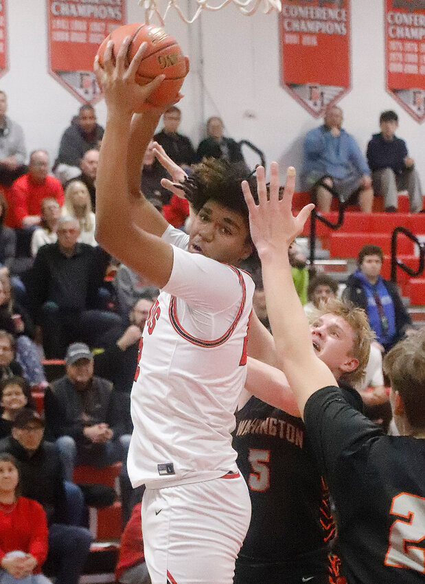 Fort Madison sophomore Darius Foy hauls in a pass from Nolan Guzman in the second quarter of Monday's 72-50 win over Washington in Class 3A Substate 6 action.