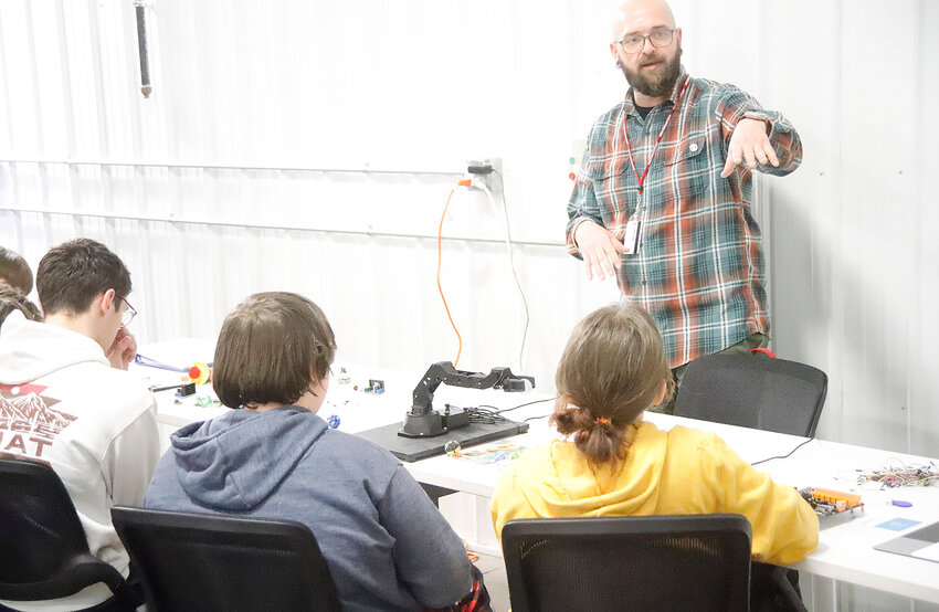 Eighth grade students from Central Lee listen to a presentation on robotics from a Southeastern Community College instructor Wednesday afternoon at the Career Advantage Center in Montrose.