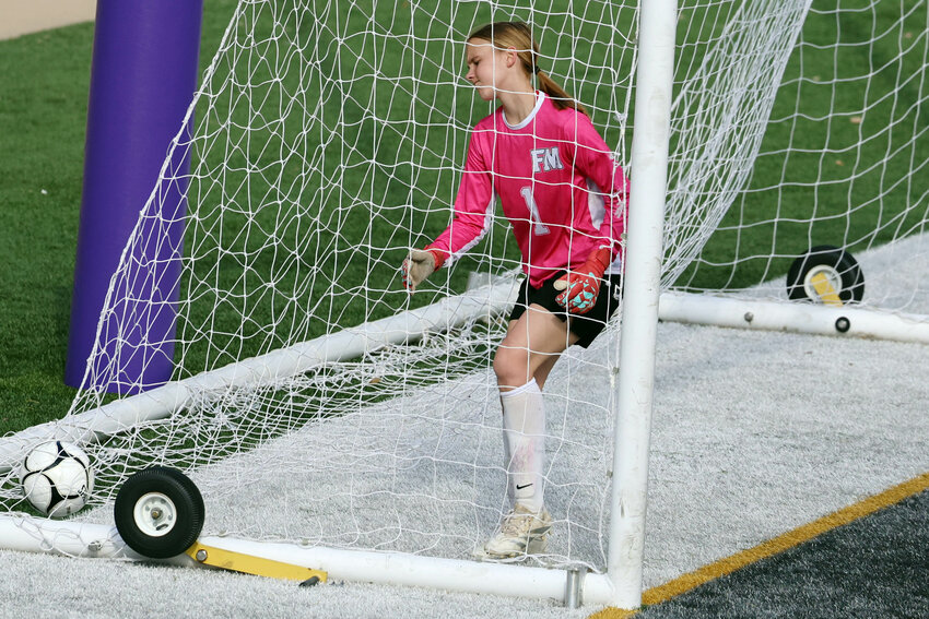 Fort Madison High School goalkeeper Ellie Hellman (1) retrieves the ball after being scored on during their game against Burlington High School, Monday, May 5, 2025 at Burlington's Bracewell Stadium.