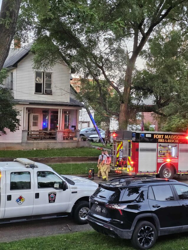 Fort Madison firefighters work on an internal house fire Thursday around 6:30 p.m. in the 500 block of 6th Street. Three residents and multiple pets were rescued from the home during the fire.