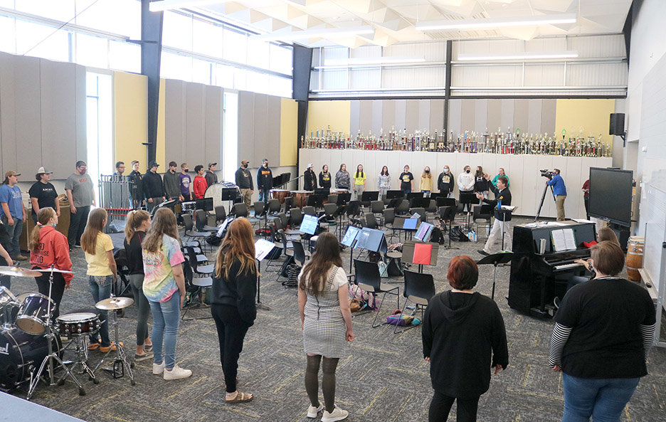 Central Lee Vocal Music Director Tracy Madsen works with students in the new fine arts auditorium Monday morning. Photo by Chuck Vandenberg/PCC