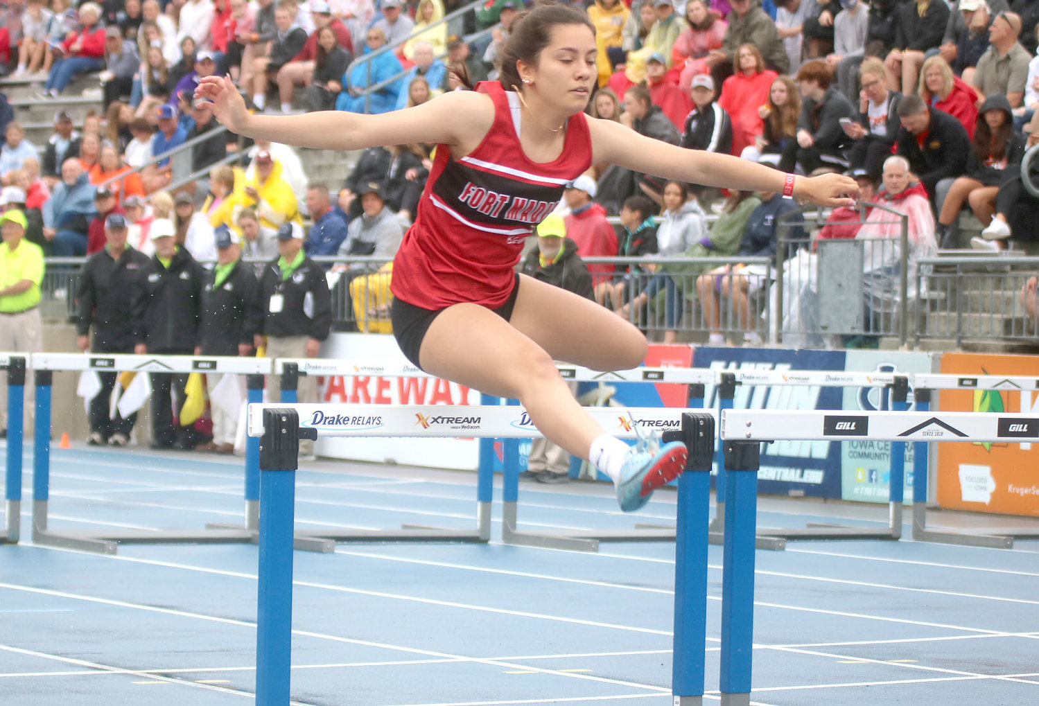Fort Madison senior Reyna Lampe gets over the second hurdle in the shuttle hurdle relay Thursday morning at the IHSAA/IGHSAU Co-Ed High School State Track and Field Championships. Photo by Chuck Vandenberg/PCC