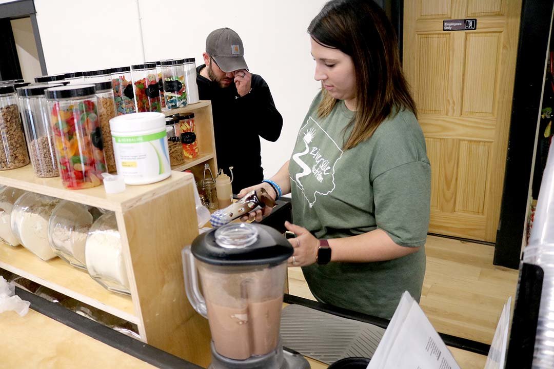 Shawna Hamilton prepares a protein shake at Riverside Nutrition in downtown Fort Madison. Hamilton opened the business with her husband and is seeing customer traffic above what she had anticipated opening the nutrition club. Photo by Chuck Vandenberg/PCC