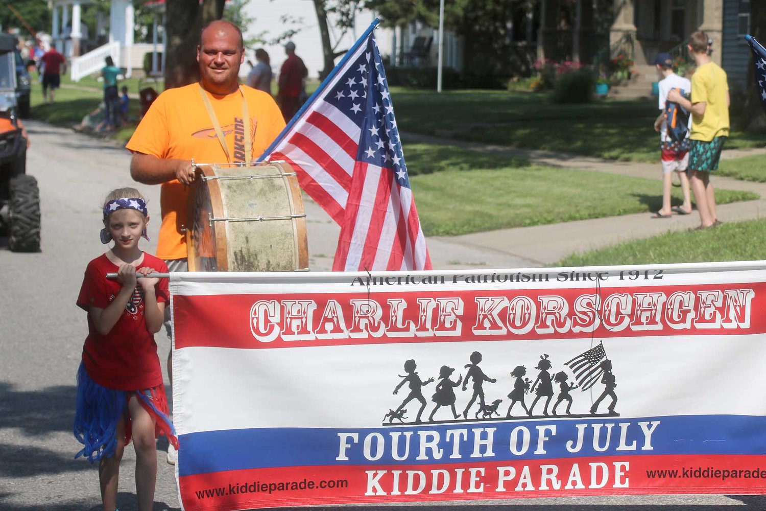 Fort Madison's Jesse Rudd brings up the one-man bass drum as the Charlie Korschgen Kiddie parade kicks off Saturday in downtown Fort Madison. Photo by Chuck Vandenberg/PCC