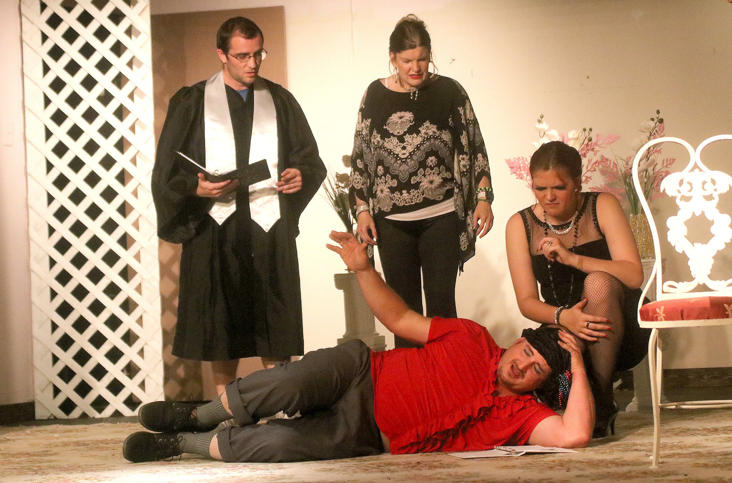 Ty Clute playing "Raul" holds on after a dastardly deed at a wedding rehearsal in OFP's 'As Long As We Both Shall Live" playing at the Fort Madison playhouse starting this weekend. Photo by Chuck Vandenberg/PCC