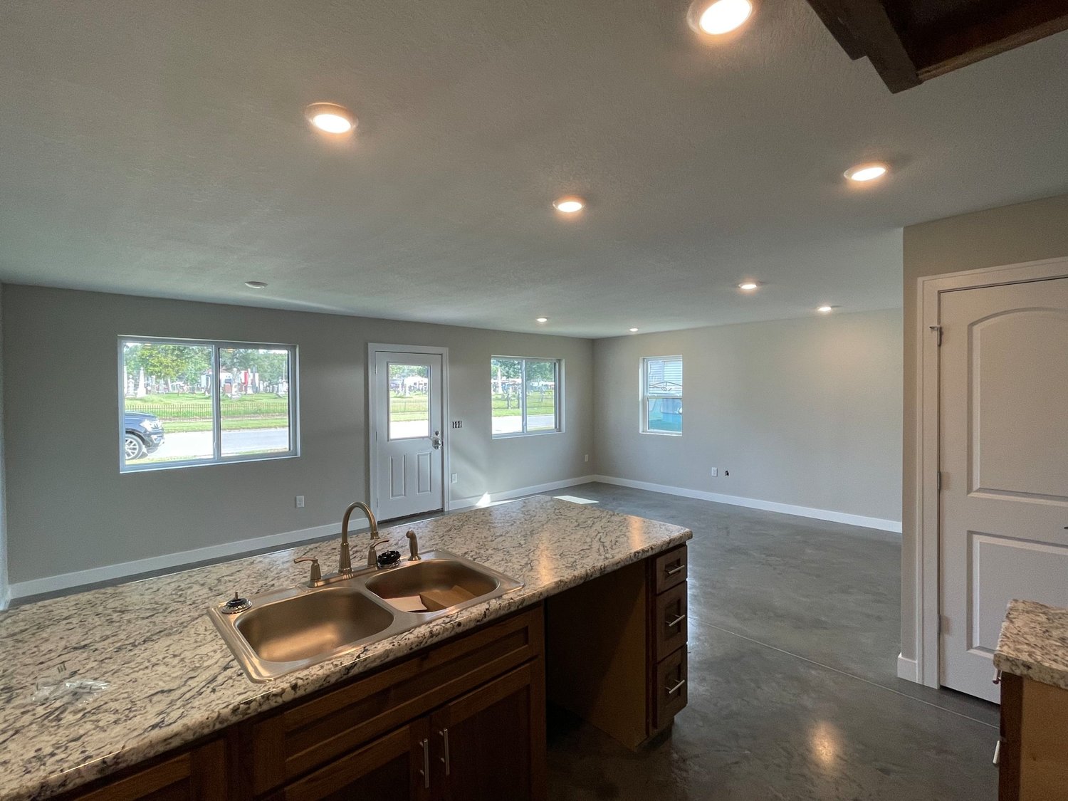 A view from the inside of the new efficient-model home built by Green Oak Development shows the large interior foot print and the view out onto Avenue H. The cement floors contain water tubes that serve as radiant heat for the all-electric home. Courtesy photo.