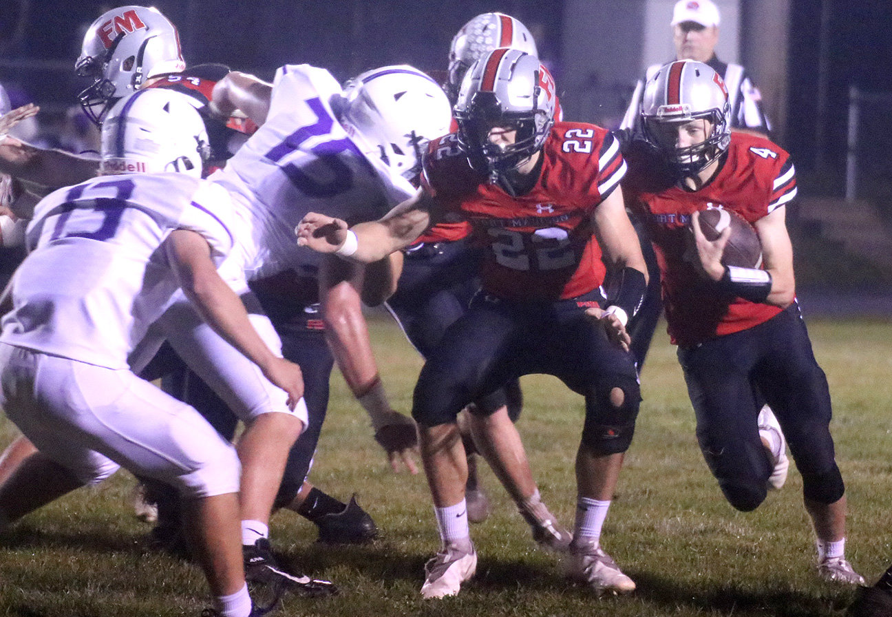 Bloodhound quarterback Landes Williams follows Jakob McGowan into the hole on a play last week in the Hounds' 24-16 loss to Iowa City Liberty. Fort Madison takes on top-ranked North Scott Friday night on the road. Photo by Chuck Vandenberg/PCC
