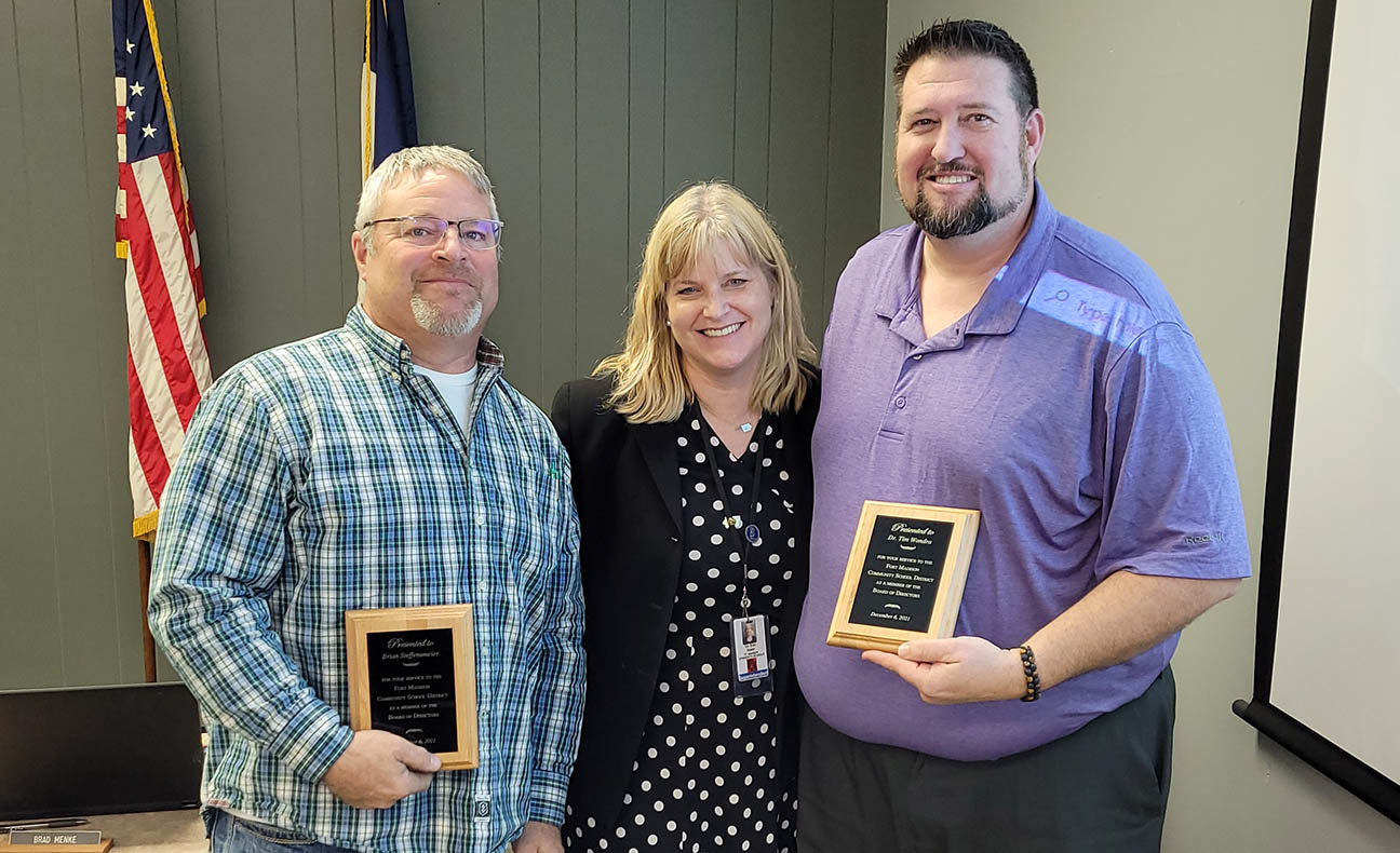 Outgoing board members Brian Steffensmeier, left, and Tim Wondra, right get plaques from FM Superintendent Dr. Erin Slater at Monday's meeting. Photo by Chuck Vandenberg/PCC