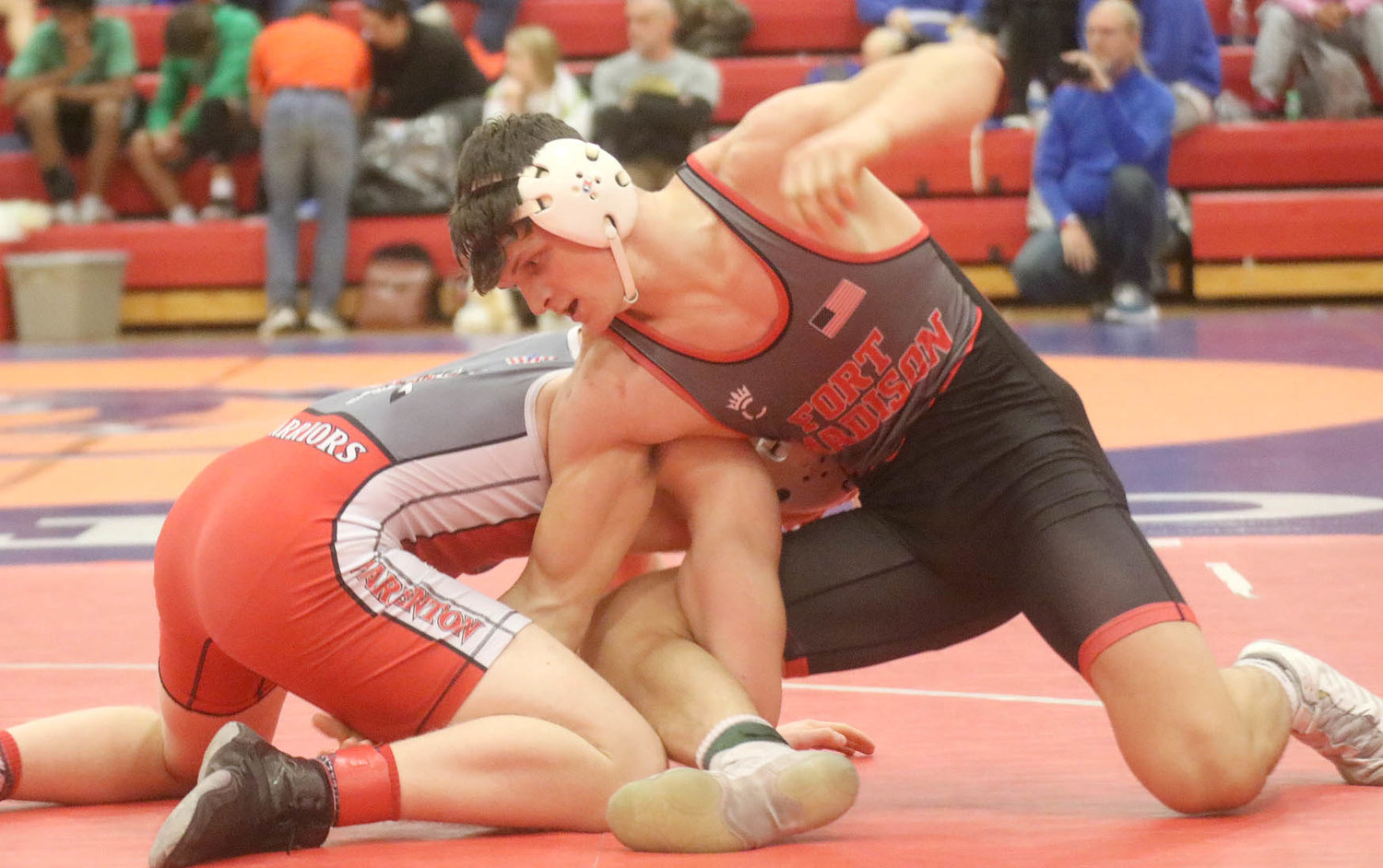 Fort Madison's Jake McGowan looks for position against Andrew Sommer, of Warrenton, Mo., at the Wentzville Invitational Saturday in Missour. McGowan swept through the 182 lb bracket to take first at the meet. Photo by Chuck Vandenberg/PCC