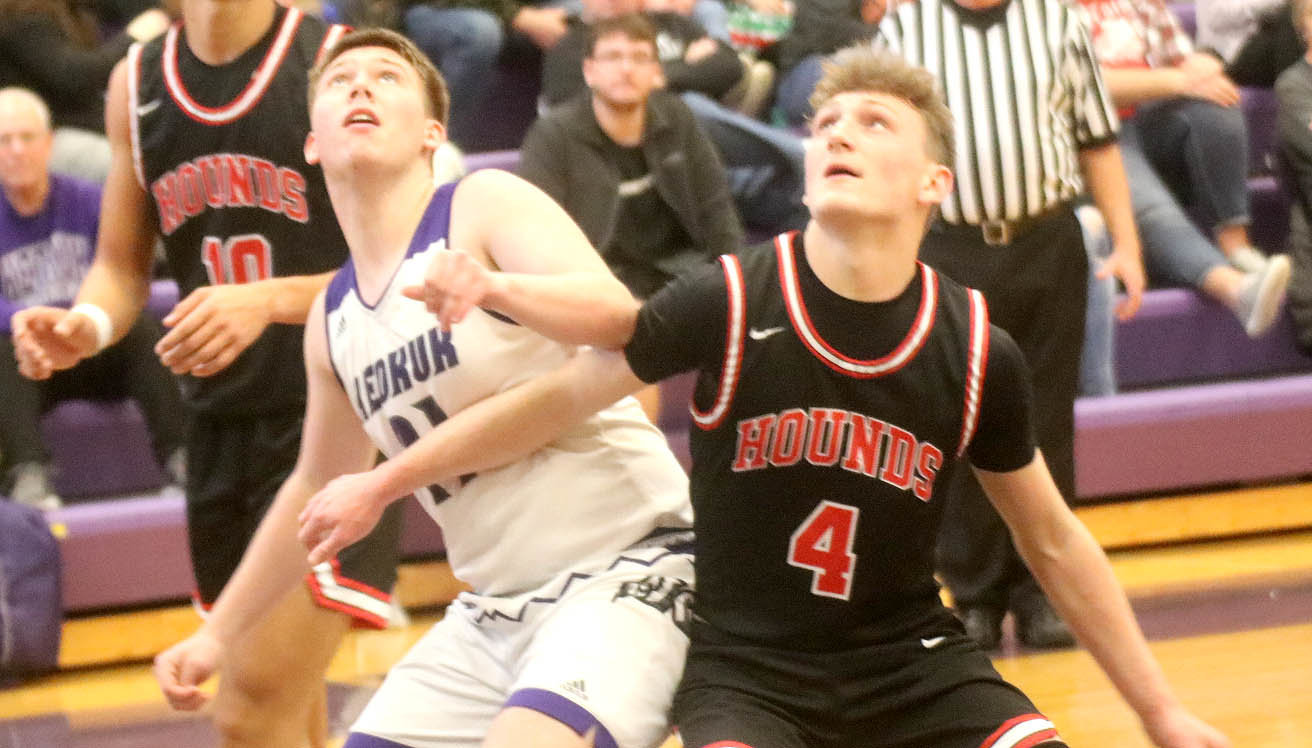 Fort Madison's Landes Williams (4) battles with Josh Wills of Keokuk in the first half of the Hounds 53-28 win over Keokuk Friday night in Keokuk. Photo by Chuck Vandenberg/PCC
