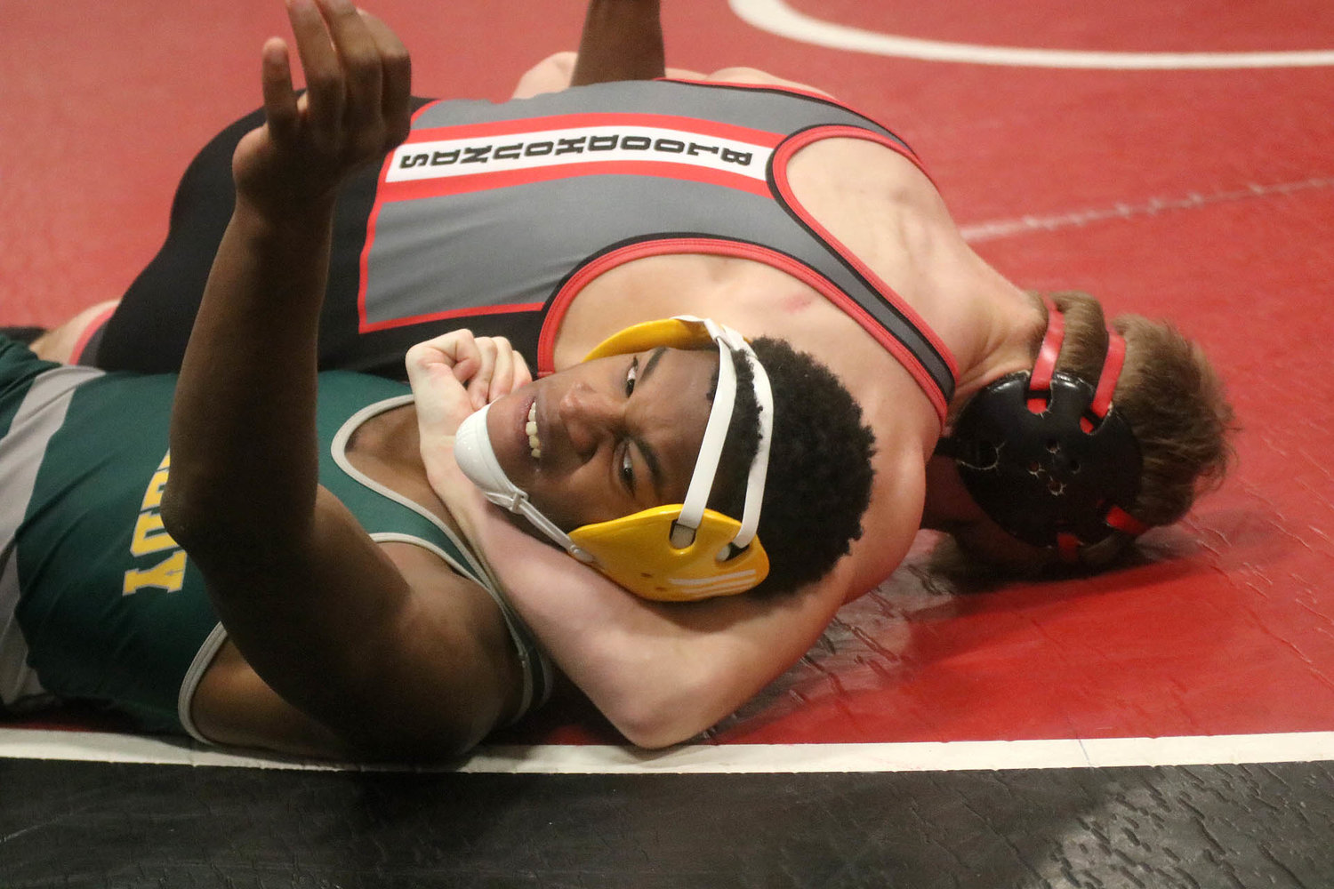 Fort Madison's Teague Smith is seconds away from a pin over Cedar Rapids Kennedy's Rashon Jennings in the first period of the consolation semi-finals at the Fort Madison Invitational Saturday at FMHS. Photo by Chuck Vandenberg/PCC