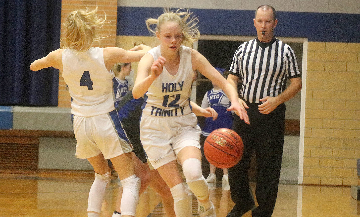 HTC's Natalie Randolph brings the ball up the floor in the 4th quarter, as Teagan Snaadt helps with the full quarter pressure. The Crusaders fell to the Arrows 48-45. Photo by Chuck Vandenberg/PCC