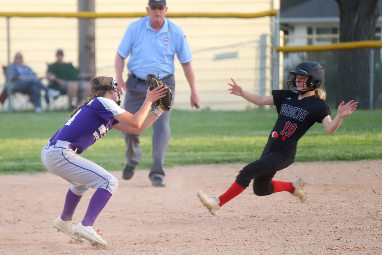 Fort Madison's Macey McLees tries to slide high at second base but would get called out on the play. Fort Madison swept BHS 4-3 and 9-8 in Southeast Conference softball Monday night.