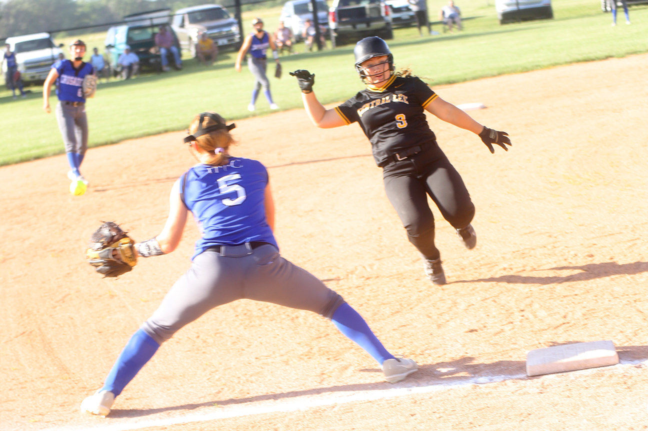 Central Lee's Jayln Hawk (9) gets ready to get dirty at third as HTC's Kayla Box (5) awaits a throw. Hawk would be safe on the play as Central Lee rolled to a 13-1 win Tuesday in Donnellson. Photo by Chuck Vandenberg/PCC
