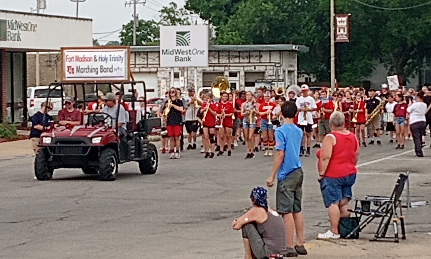 A combined Holy Trinity Catholic and Fort Madison marching band provides music during Monday's Charlie Korschgen 4th of July Kiddie Parade in downtown Fort Madison. This year's event had 238 participants