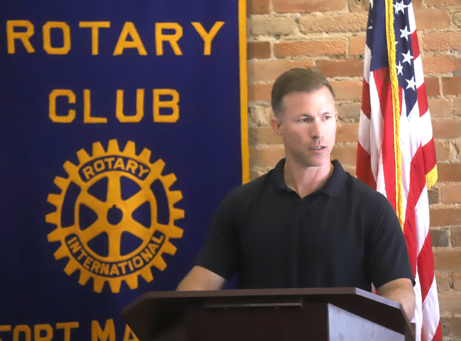 2000 Aquinas graduate Andy Rump talks with Fort Madison Rotarians Tuesday about his career as a naval aviator and weapons specialist, and his role as Tom Cruise's stand-in on Top-Gun-Maverick.
