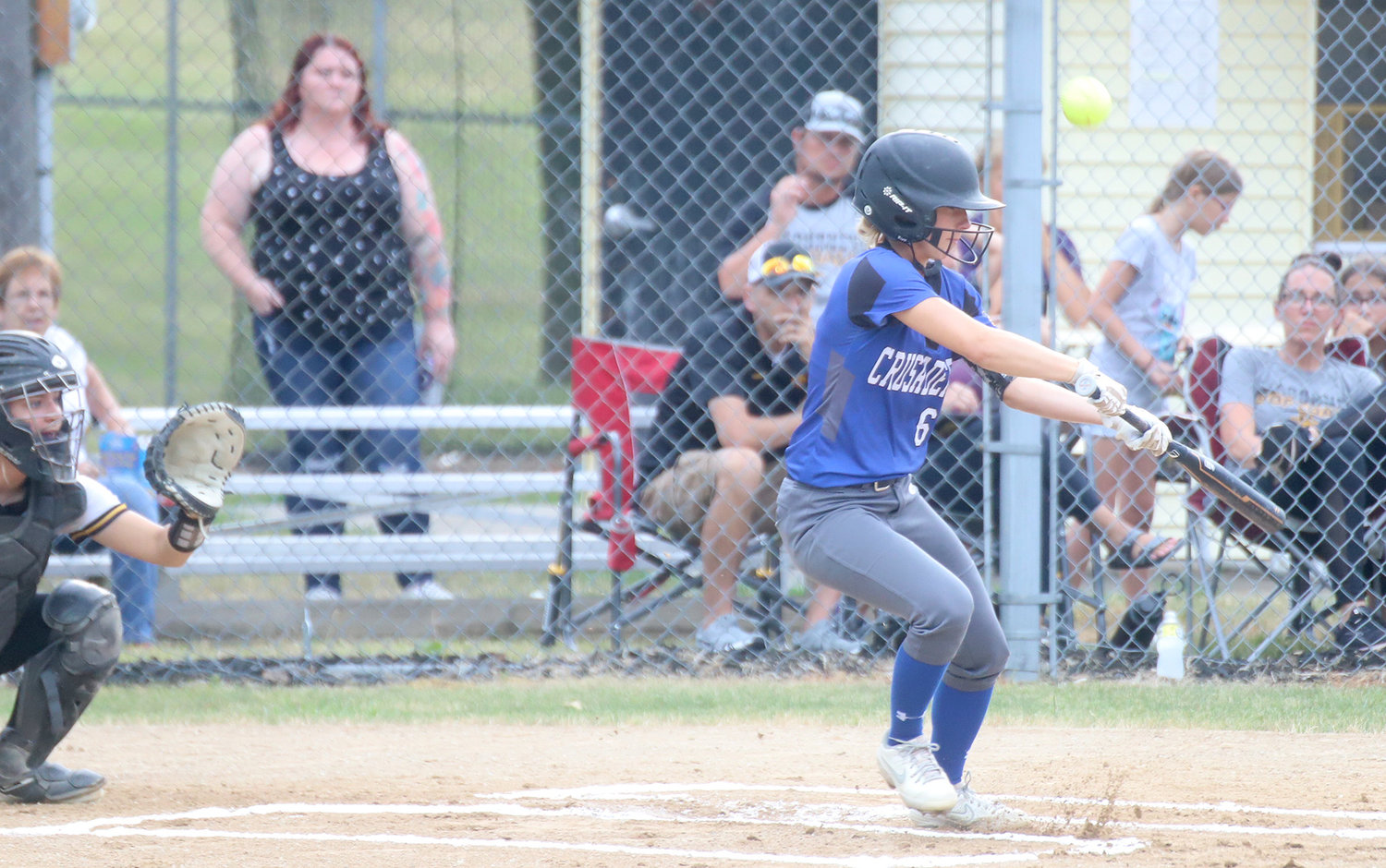 HTC's Anna Sobczak tries to get a drag bunt down in the third inning but pops the ball back foul. The Crusaders fell 11-1 to Sigourney to end their season at 10-11.