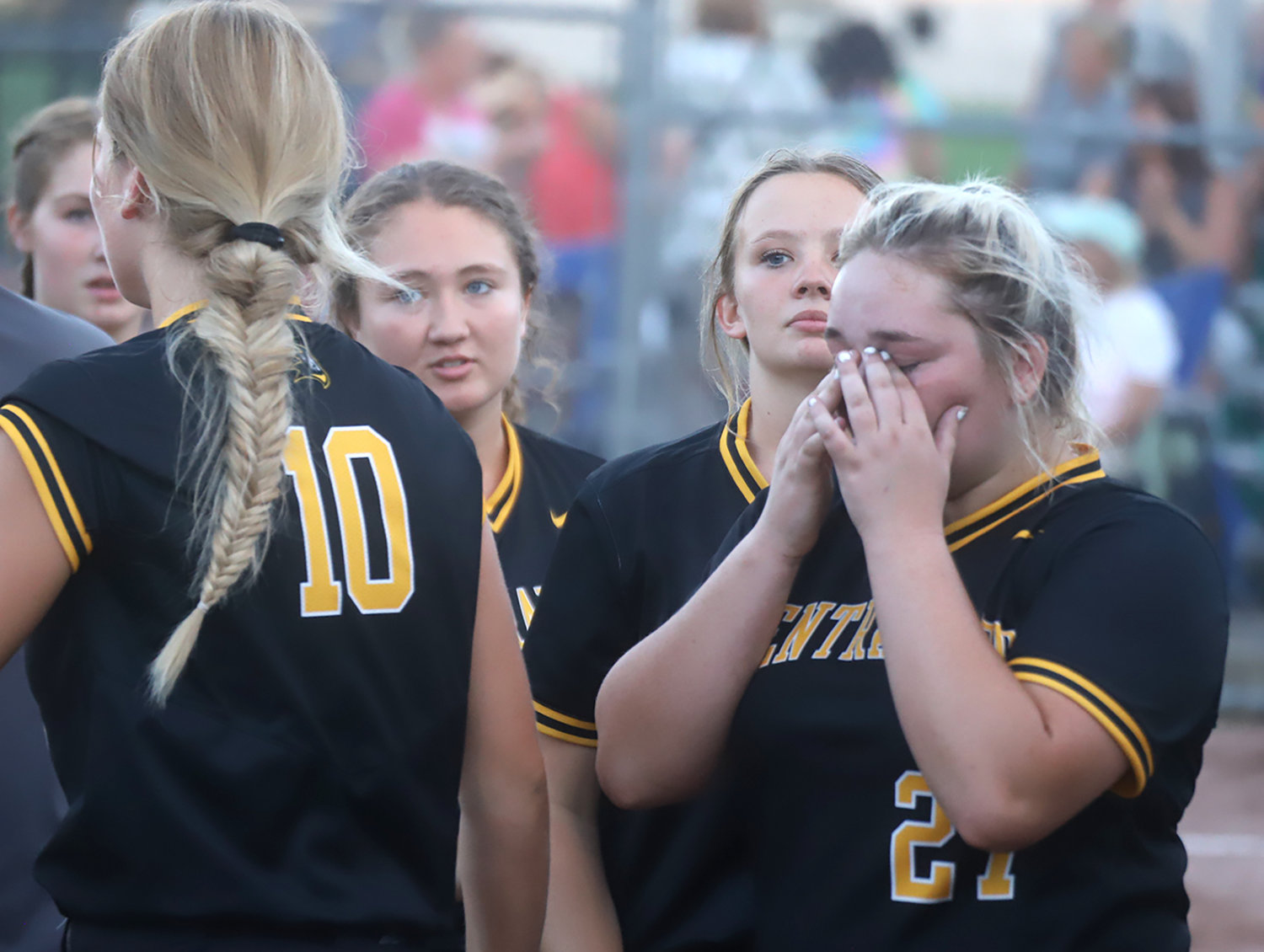 Sophie Turner (27) wipes away tears after congratulating the West Burlington/Notre Dame Falcons on the Region 8 semifinal win Saturday in West Burlington.