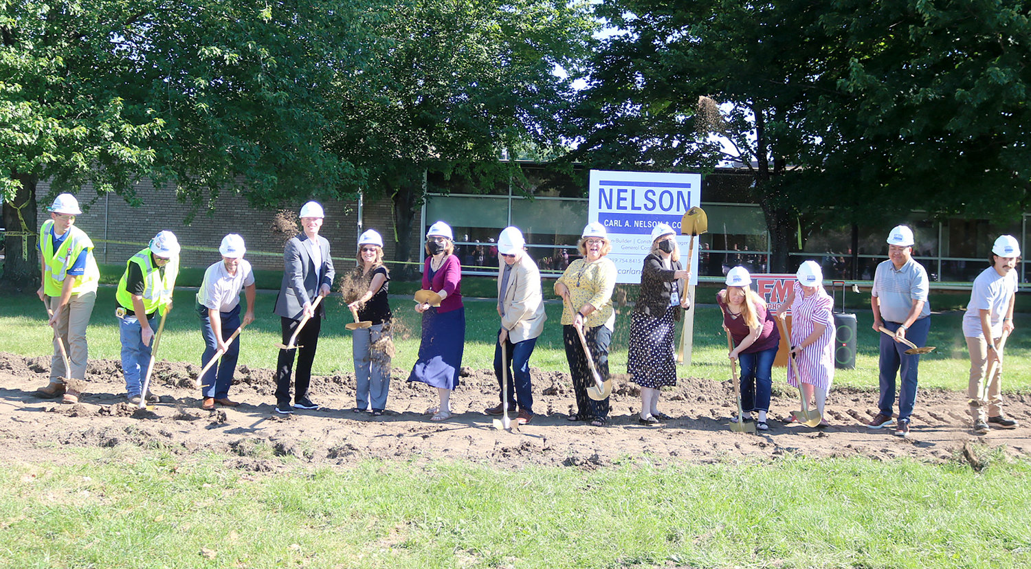 Fort Madison dignitaries and guests help break ground on the district's facilities upgrade at Fort Madison High School Tuesday morning.
