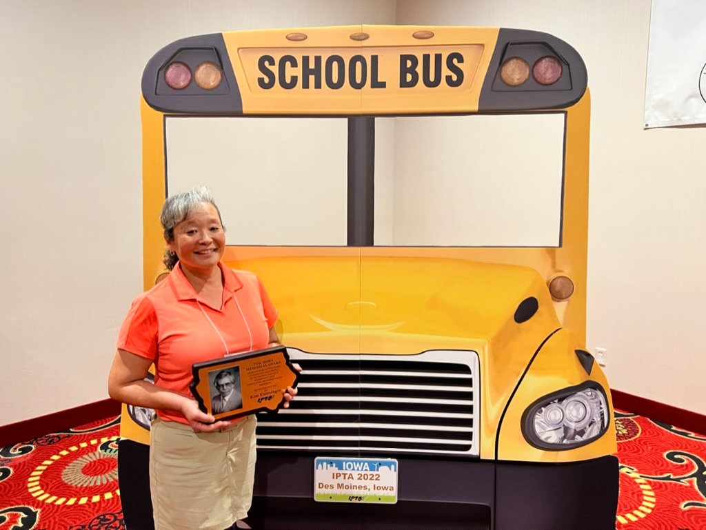 Kim Ensminger of Central Lee, poses with her Tom Horn Memorial Award from the Iowa Pupil Transportation Association.
