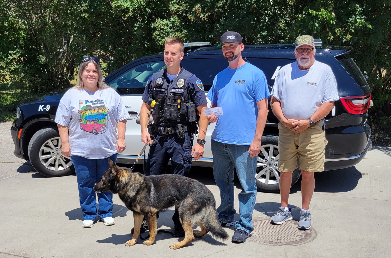 From left to right Kim Krogmeier (Pen City Crusider Club Treasurer), FMPD K9 officer Greg Warosh with K9 Norik in front, Chad Schneider (President), and Ron Tanner (Vice President) Not pictured is Jessica Weiler (Club secretary). The club presented the FMPD with $1,000 to be used for the K9 unit. Courtesy photo.