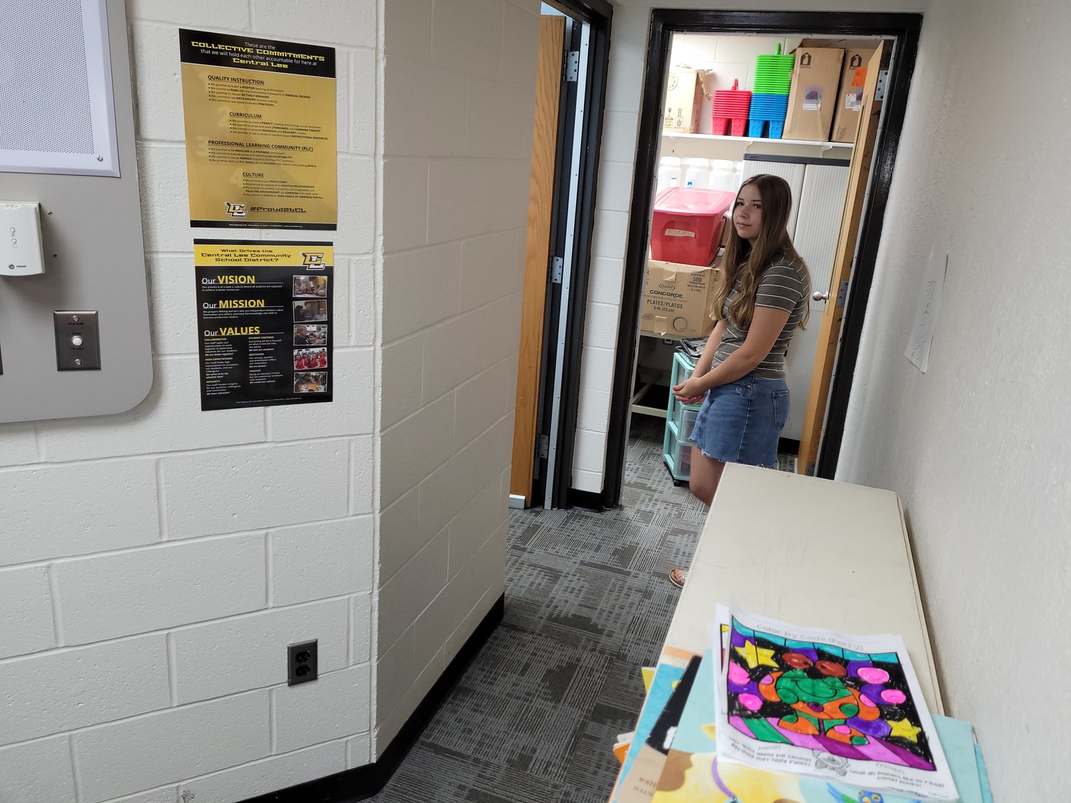 Incoming freshman Aubrey Weber, stands in the hallway of two former band practice rooms at Central Lee elementary school. The walls in front of her will be brought down and a door added to the front to create a larger sensory room for neuro-diverse challenges.