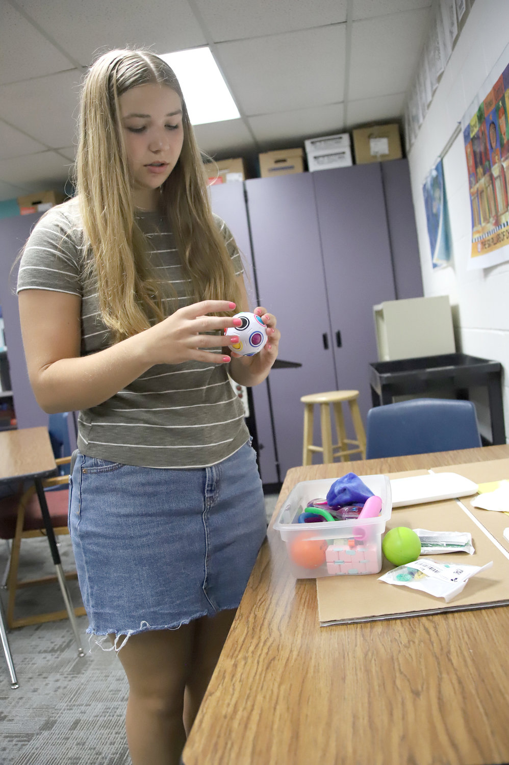Weber shows some of the tactile pieces that will be part of a new sensory room at Central Lee High School.  Weber won a Community Future Problems Solvers' International competition in June.
