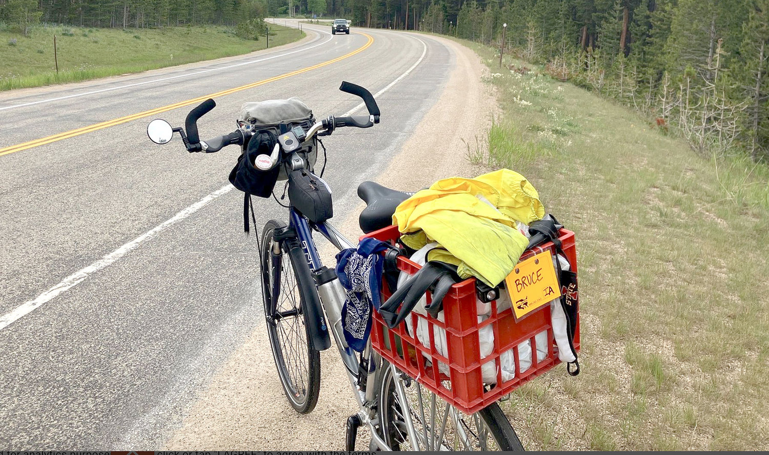 Huddleson's bike sits on the roadside along a mountain pass in Wyoming.